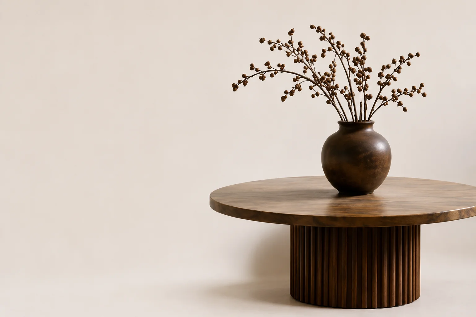 Round bespoke coffee table with a ceramic vase